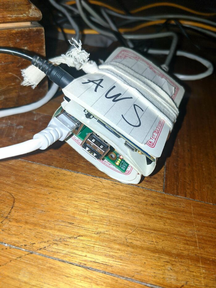 Dual Node Arm Server "Rack" Made Of Old Playing Cards And An Elastic Band. The Whole Budget Was Zero So It Has A Price To Performance Ratio Of Infinity. (Og Raspberry Pi And Orange Pi PC+, All From Random Parts Bin)