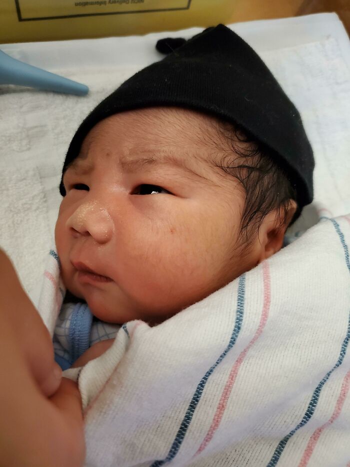A Picture Of My Grumpy Newborn Baby Brother Giving Judgmental Looks