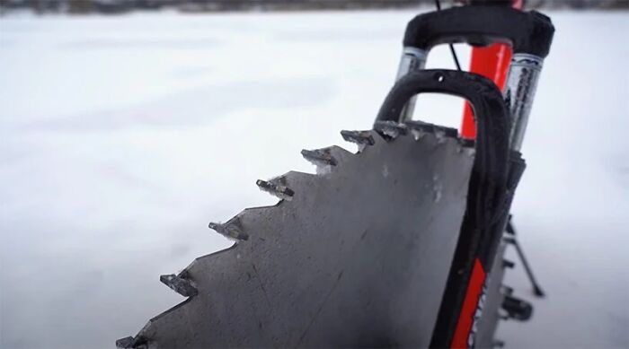 Man Replaces Bike Tires With Circular Saws And Goes For A Spin On A Frozen Lake Man Replaces Bike Tires With Circular Saws And Goes For A Spin On A Frozen Lake