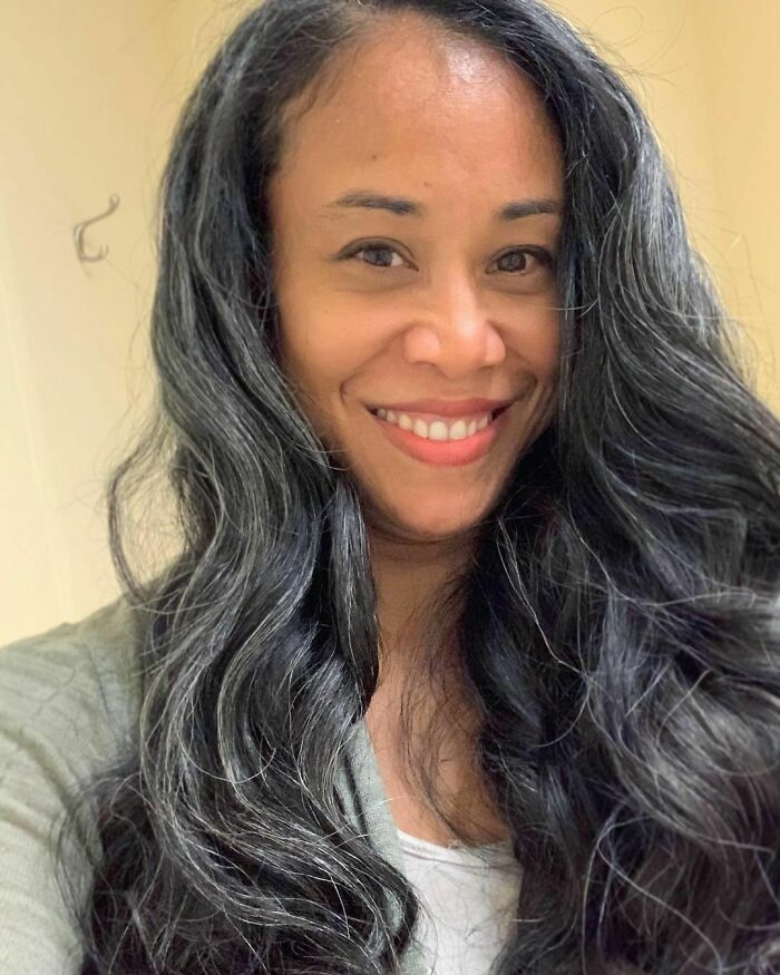 “I Noticed Grays In My Late Teens But Didn't Think Much Of It At The Time. Fast Forward To My Early Thirties. Two Children Later And A Plethora Of Gray Sprouting Up All Over The Place! I Admittedly In My Attempts To ‘Not Look Old’ Would Dye It, But The Color Would Never Keep More Than A Week Or Two. I Simply Don't Have The Patience For That Kind Of Upkeep So I Decided To Just Let Nature Take Its Course. I Do Find Myself Occasionally Wavering Between Whether Or Not To Color Or Cut It, But In The End I Opt Against It. My Husband Refuses To Let Me Dye It Because He's Never Seen Me Without The Gray Lol. I Also Receive Numerous Compliments On The Color. I'm Learning Slowly To Accept That I'm Not Supposed To Look Like I Did 20 Years Ago, As I Am Also Not The Same Person I Was 20 Years Ago. My Gray Is A Part Of Who I Am. All My Joys And Sorrows Of The Past 47 Years.” @christinemoore1378 #grombre #gogrombre #grombabe