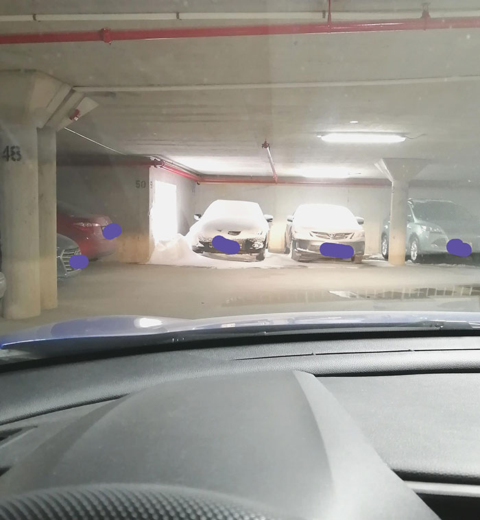 It Snowed Two Feet Overnight And This Unlucky Neighbor's Car In The Underground Parking Lot Is Next To A Large Grate