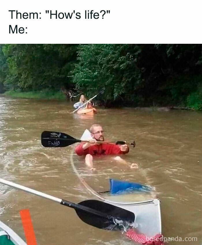 Man paddling through a flooded street with a kayak and a sword, showing a hilarious meme situation most people relate to.