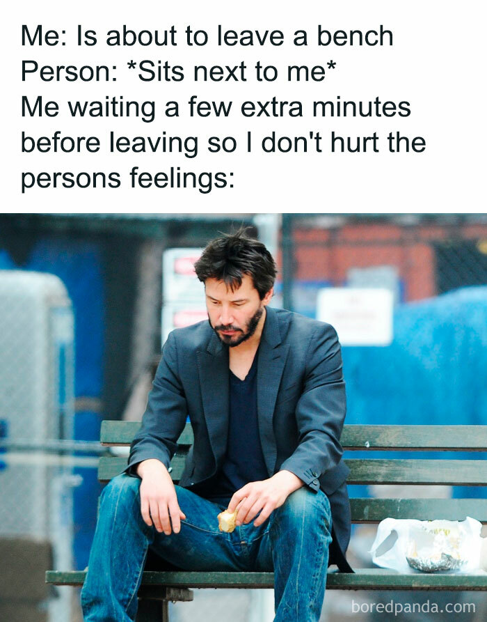 Man sitting on a bench with sandwich, feeling considerate. Hilarious memes relatable to people.