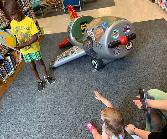 This Little Kid Offered To Read My 1-Year-Old Daughter A Book At The Library. She Was Very Intrigued And Loves Waving At People She Likes