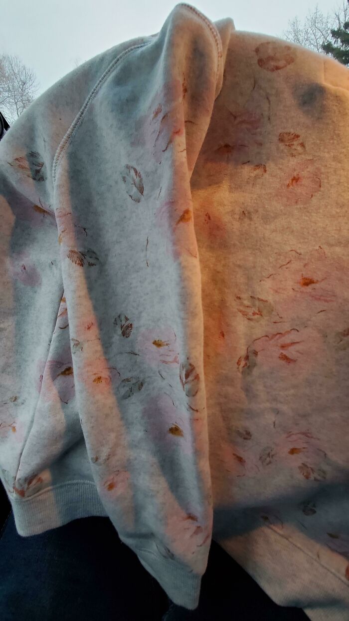 This Flower Sweater That Looks Like It Has A Bunch Of Stains