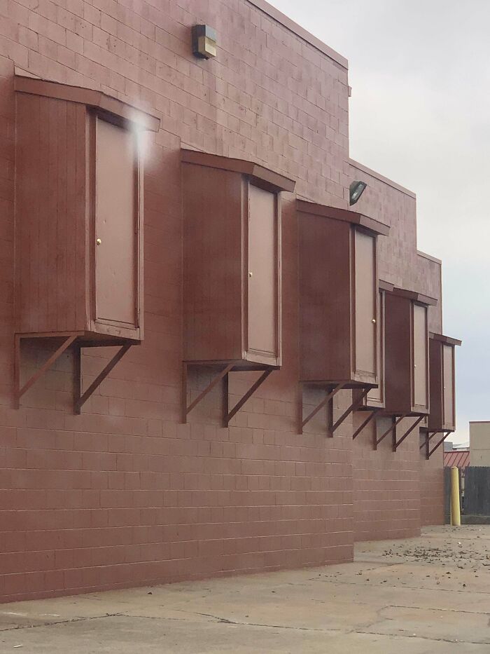 Small Boxes With Dead Bolted Doors About 10 Feet Off The Ground. Wall Of A Cinema