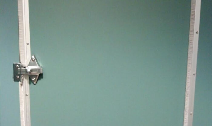 This Bathroom Stall Door Has Bristles To Cover Up The Cracks