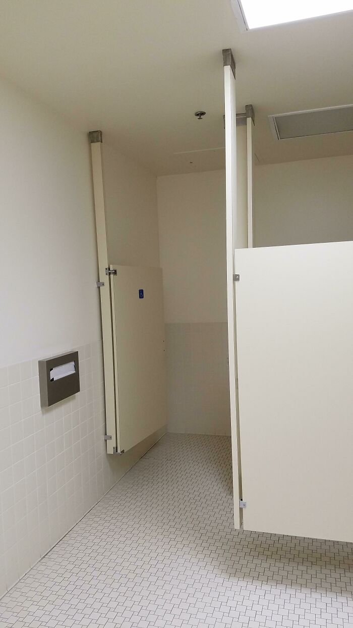 The Bathroom Stalls Here Are Fixed To The Ceiling For Ease Of Cleaning The Floor