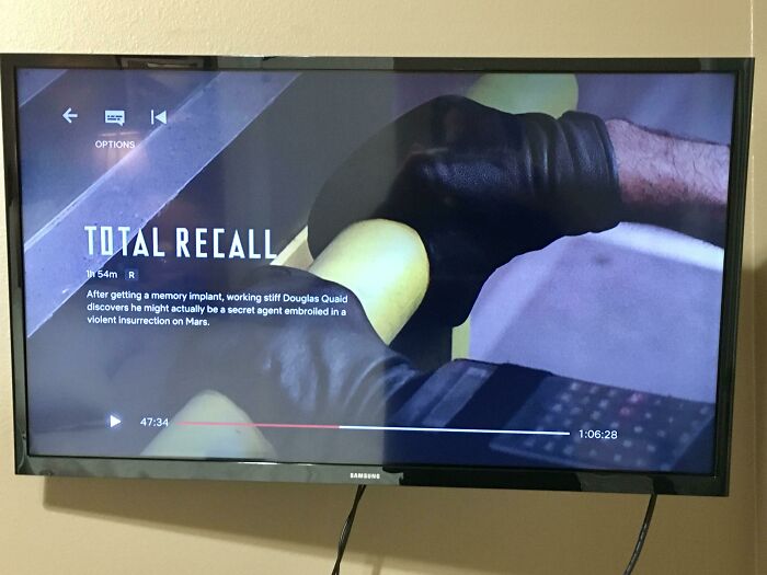 Total Recall - 1990: The High Tech Communicator Shown On The Soldier’s Wrist While He Is Trying To Hold Onto The Rail After The Dome At The Mars Colony Cracks Is A Calculator