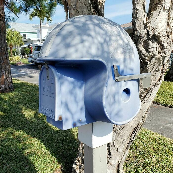 Mailbox designed as a blue football helmet, a creative and cool mailbox spotted in the wild on a sunny day.