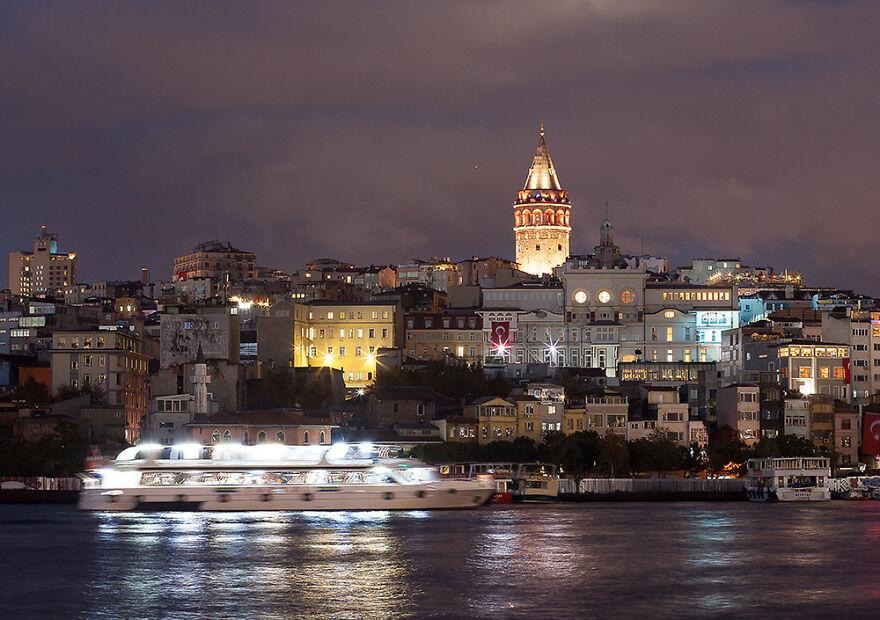 Galata Tower Photo Taken From The Other Side Of The Golden Horn At Lower Shutter Speed To Emphasize The Movement Of The Boat
