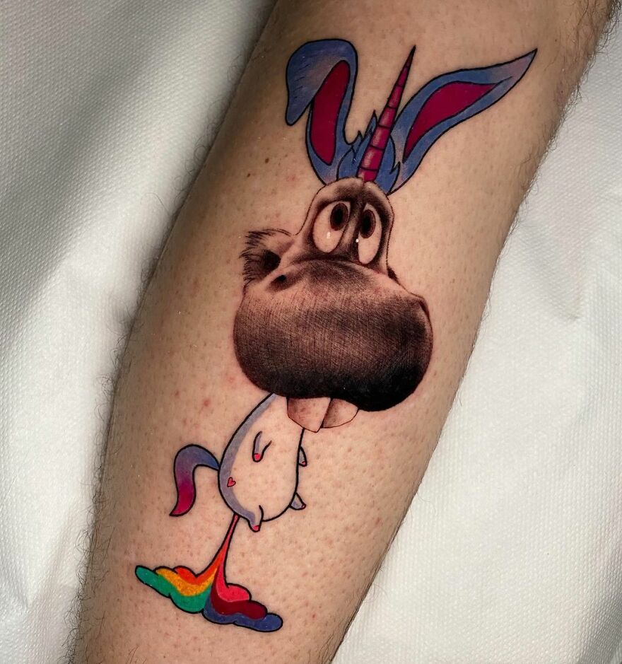 Tattoo of a whimsical unicorn character with two different styles by artist Mat Rule on a person's forearm.