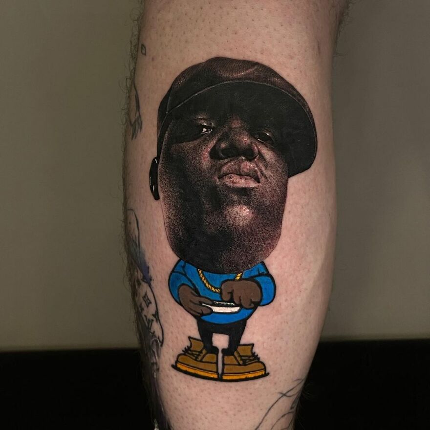 Tattoo featuring two different styles: realistic face and cartoon body design on skin.