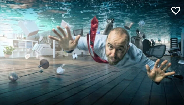 Man Swimming In A Flooded Office