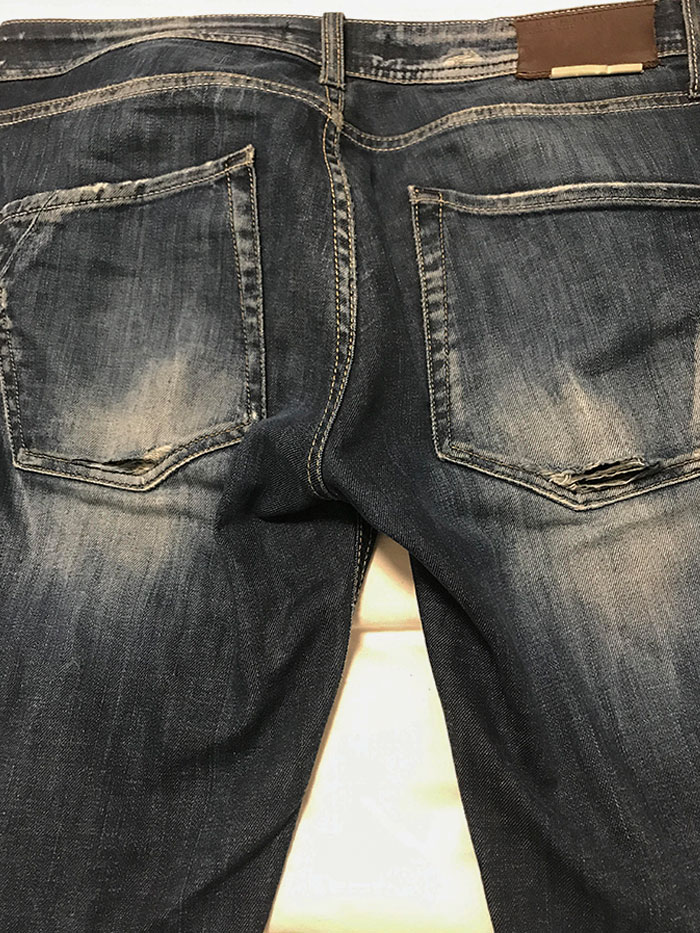 Jeans With Holes Right On The Bottom Of The Back Pockets, Why