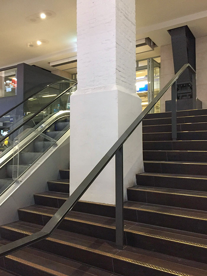 A Pillar In The Middle Of A Stairway