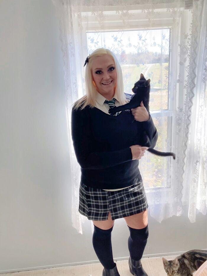 Jiji About To Scratch Me In The Face For Taking A Picture With Her Last Halloween.