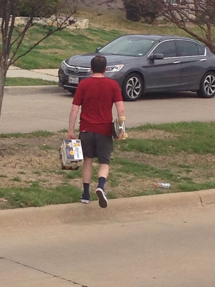 This Man Skateboarding Back From The The Store With A Whole Pack Of Beer