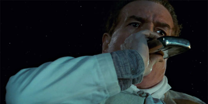 the chef drinking from a flask