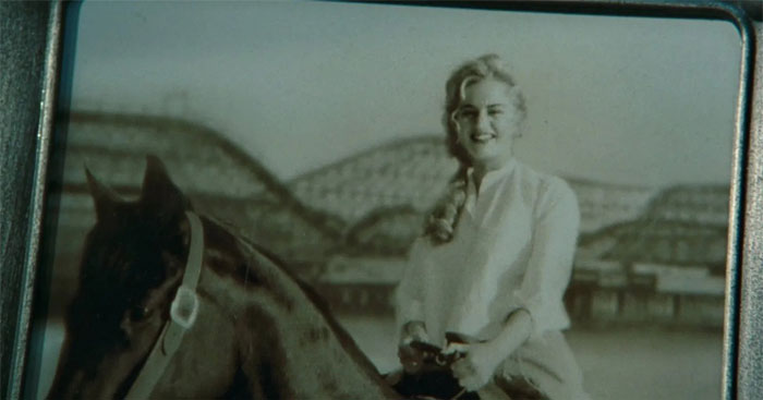 an old photo of Rose riding a horse