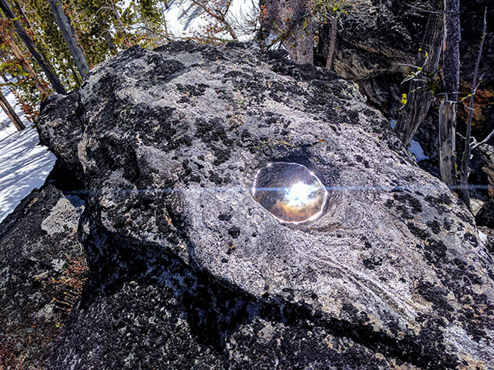 This Puddle Reflecting The Sun Looks Like A Portal To Space