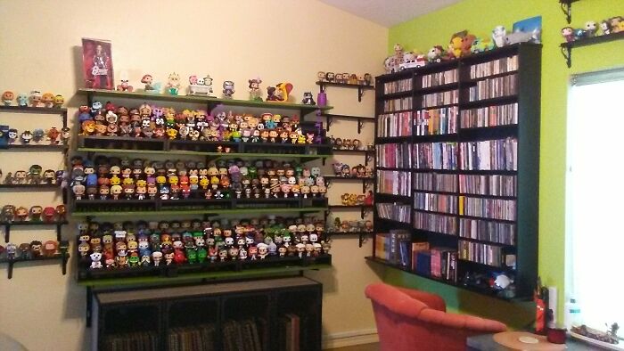 Collection Of Funko Pops And A Barbie Dressed As Ziggy Stardust