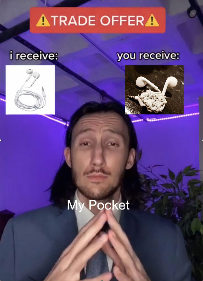 Man presenting funny "Trade Offer" meme with tangled earphones.