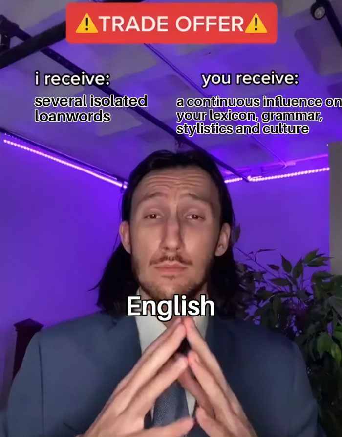 Person in suit with text: "Trade Offer." Describes exchange of language elements, part of viral meme series.