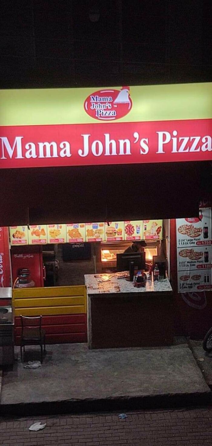 Knockoff brand "Mama John's Pizza" shopfront with bright red and yellow signage.