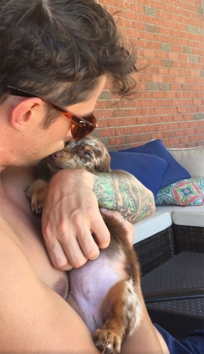 She Wiggles And Yips Incessantly... Until Her Uncle Is Holding Her