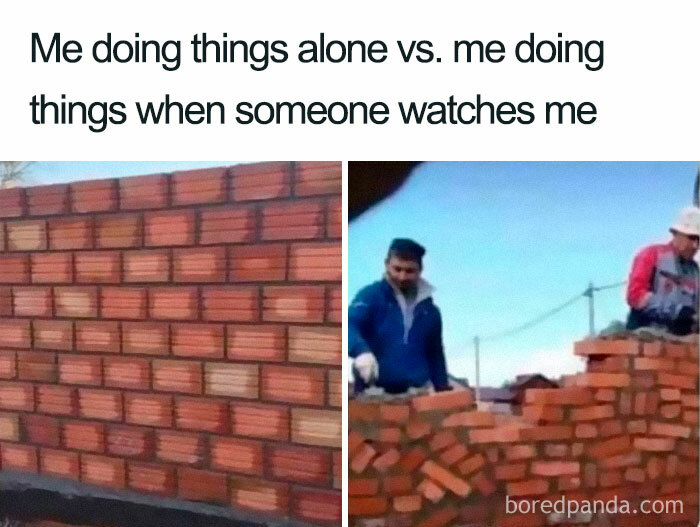 Funny introvert meme showing perfect brick wall built alone versus messy wall when watched by others.