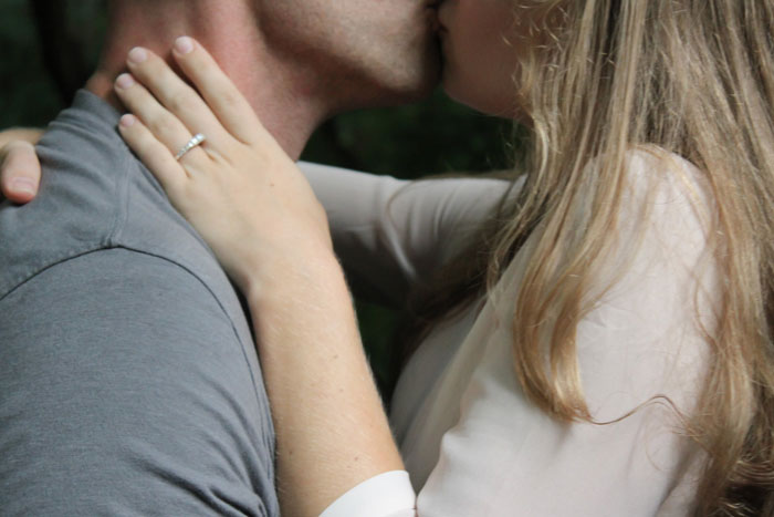 man and woman kissing