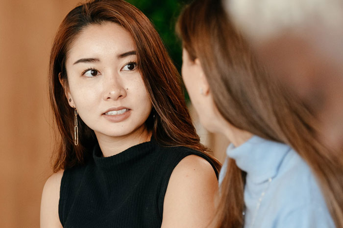 two women talking to each other