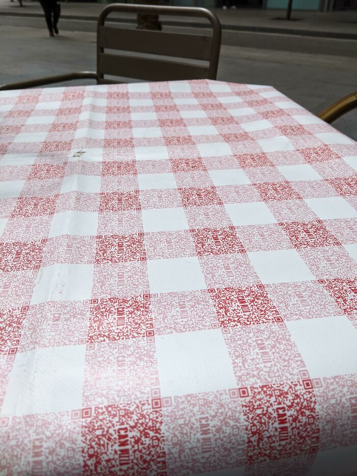 The Classic Red Checkered Pattern Of The Tablecloth Of This Restaurant Is Made Of Qr Codes For Their Menu
