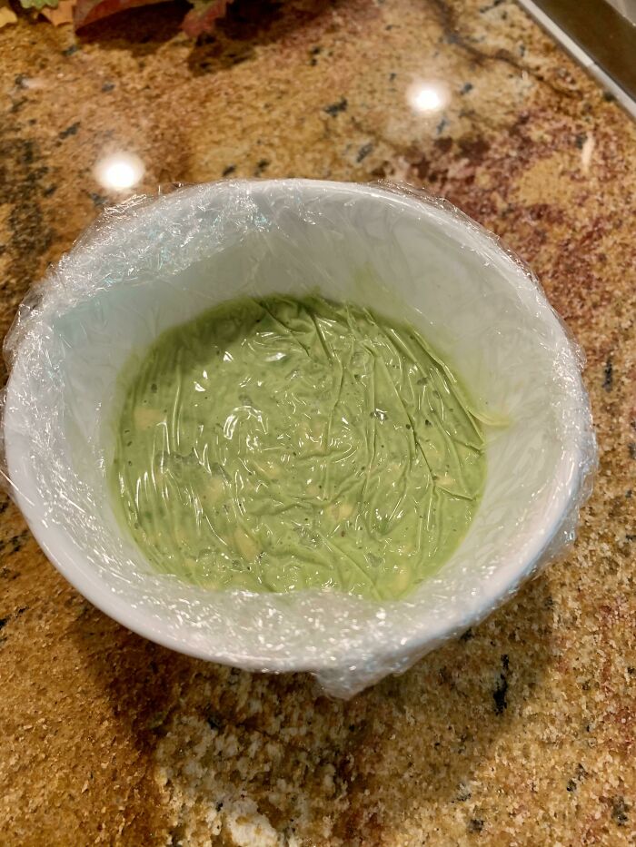 Keep Guacamole Fresh Using Plastic Wrap Pressed All The Way Down - No More Brown Spots!