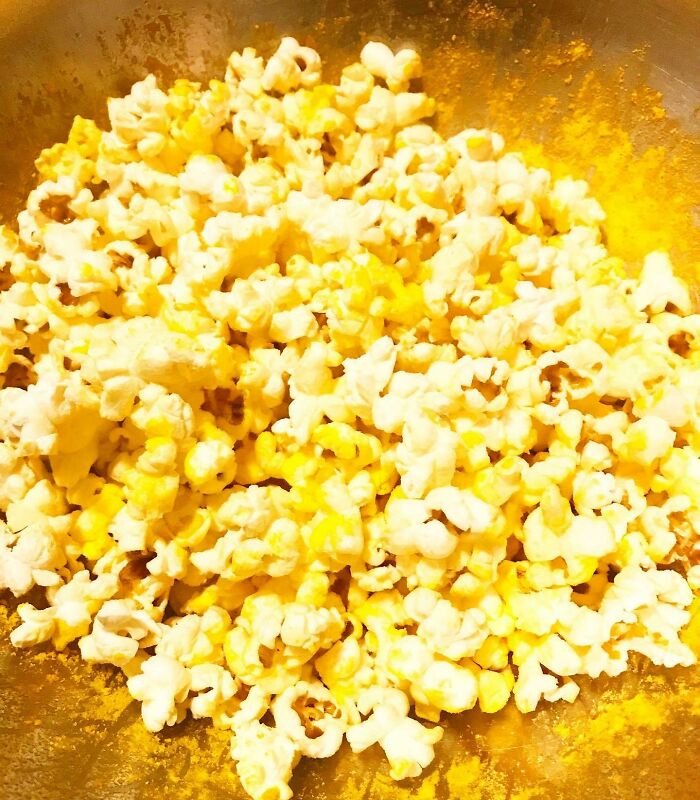 Use Mac & Cheese Powder To Season Popcorn For A Lighter Snack To Satisfy Cheesy Cravings