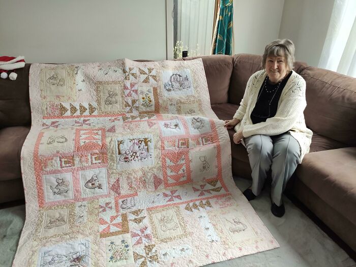 My Grandma Showing Off A Quilt She Made For My Little Sister's Birthday