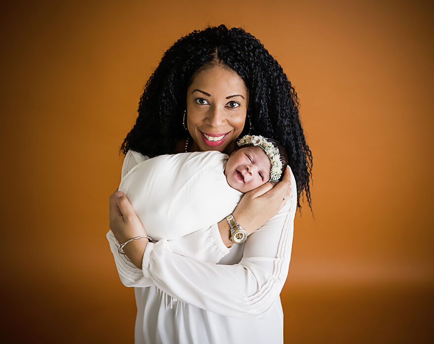 Smiling Newborn Baby Girl With Mom