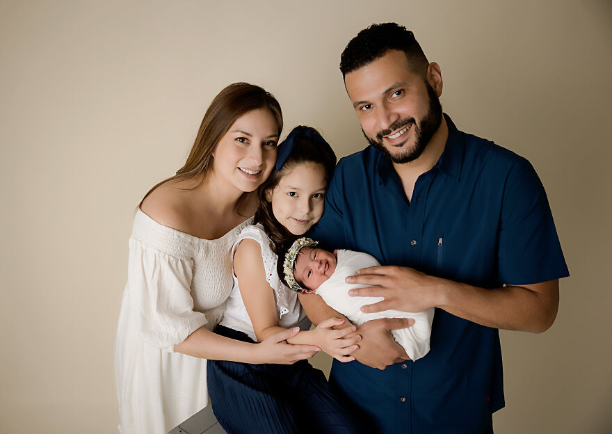Smiling Little Girl With Her Family