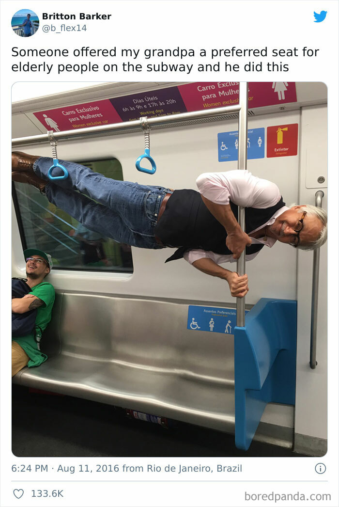 Old Man Sideways Holding Onto A Vertical Pole