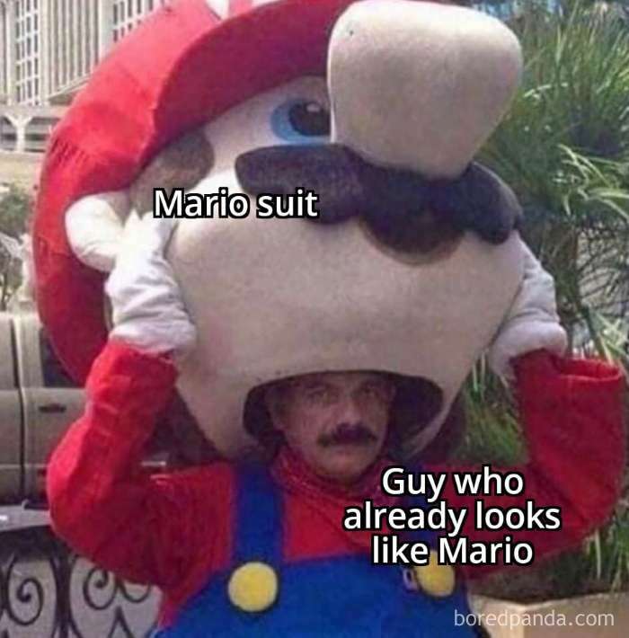 Man in Mario suit, humorously looking like Mario himself, embodying literal meme style.