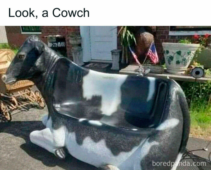Cow-shaped bench outside a house, showcasing a literal meme that's both straightforward and hilarious.