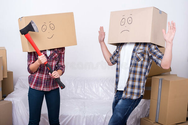 moving-home-cheerful-young-couple-cardboard-boxes-their-heads-women-holds-ax-47465901.jpg