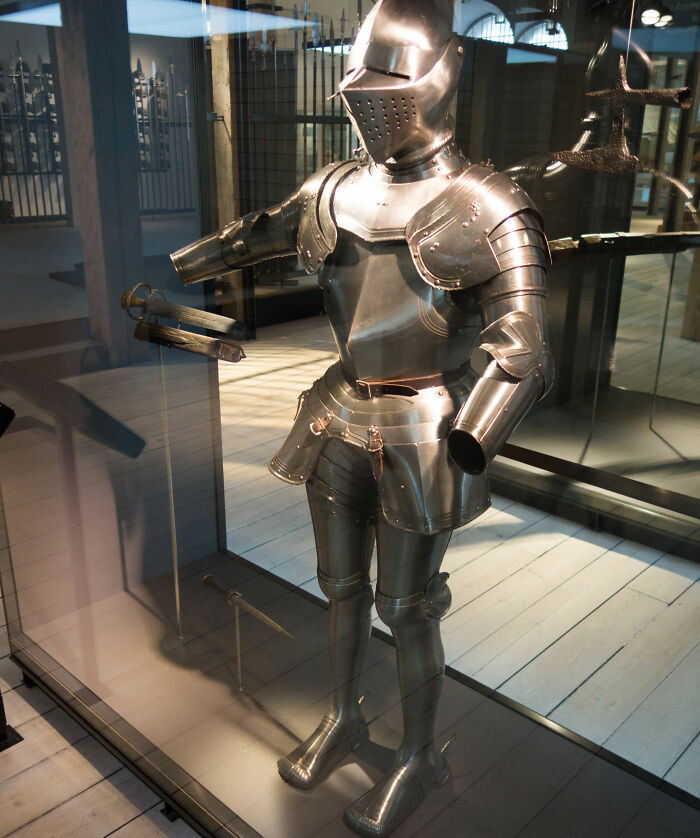 Medieval metal armor displayed in a museum representing weird laws from around the world that sound made up but are true.