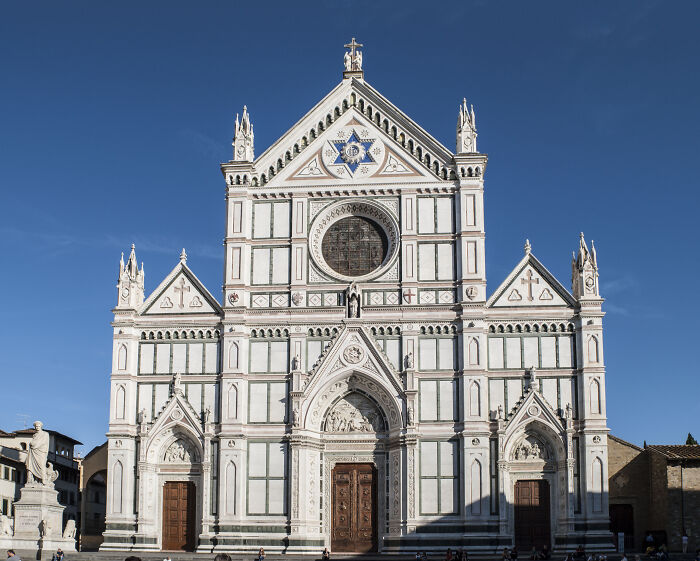 Historic cathedral exterior under clear blue sky, illustrating one of the weird laws from around the world that sound made up.