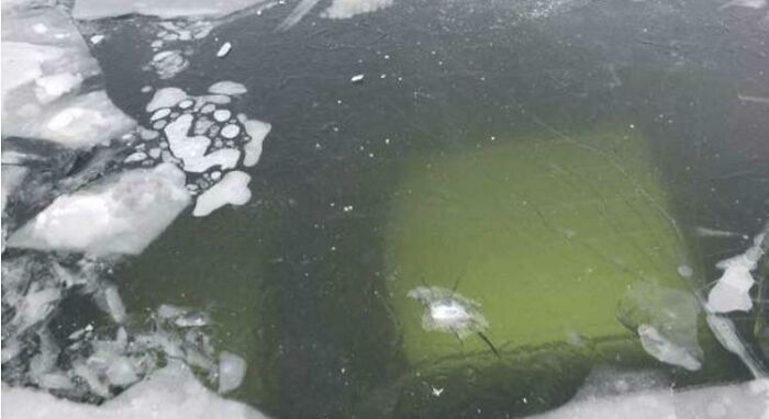 Truck Falls Through Ice On Frozen Lake, New Ice Forms Over Top Of Hole (Vermont, USA)