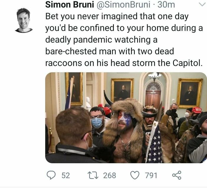 Bare-Chested Man With Two Dead Raccoons