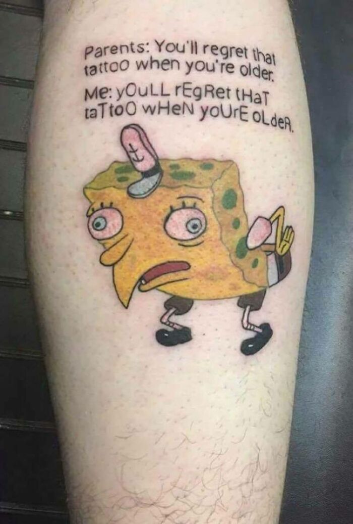 Uncool tattoo of mocking SpongeBob with regretful text above, highlighting quickly outdated tattoo choices.