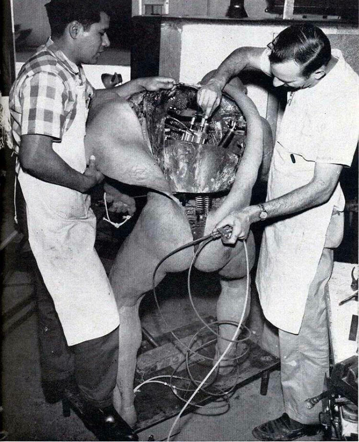 Disney Technicians Repairing An Animatronic Figure