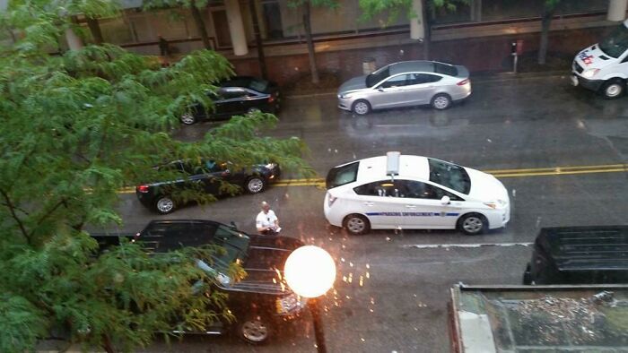 She's Writing A Ticket And Parked Her Car In The Main Traffic Lane So People Have To Drive Into Oncoming Traffic To Get Around Her